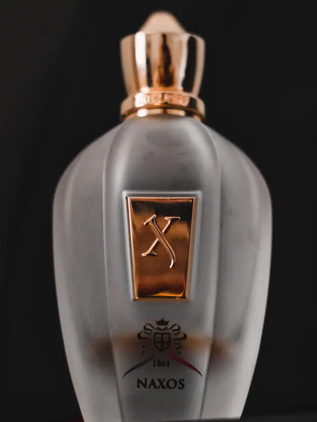 Xerjoff XJ 1861 Naxos bottle in close-up against a dark background