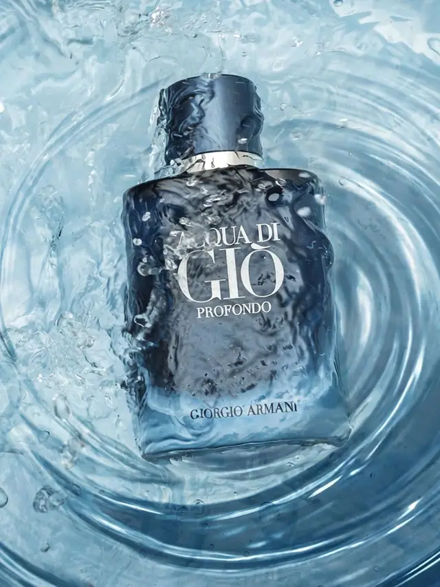 Acqua di Giò Profondo bottle sinking in rippling blue water